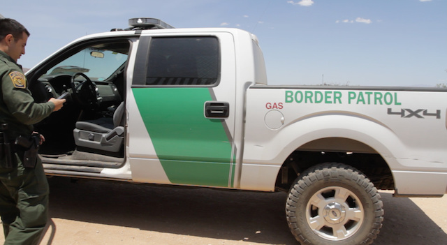 border-patrol-agent-checks-his-phone-LM